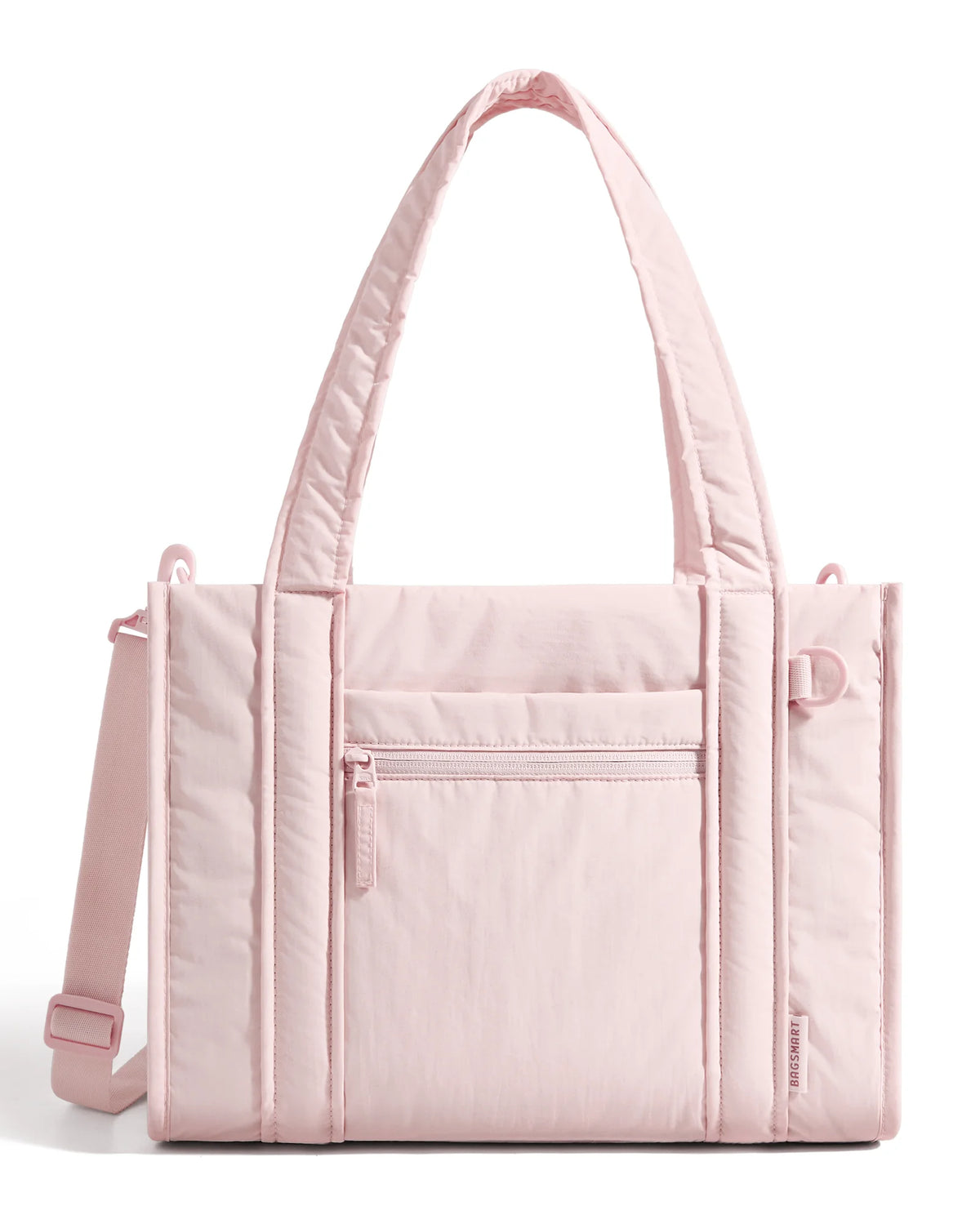 A light pink quilted tote bag with a detachable strap shown from the front.