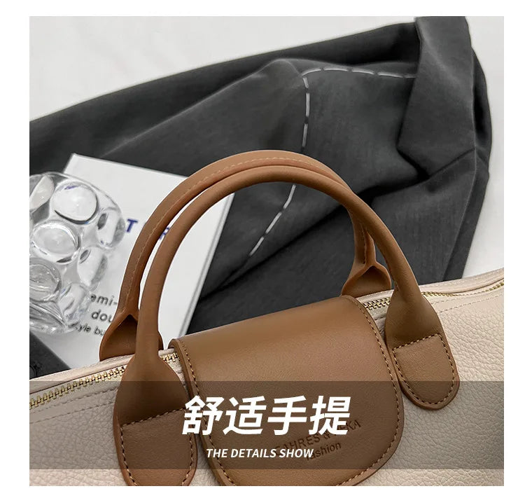 A brown vintage PU leather crossbody handbag is shown against a dark gray fabric background.