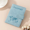 A light blue passport wallet with a leather texture and a flap, featuring a world map design.