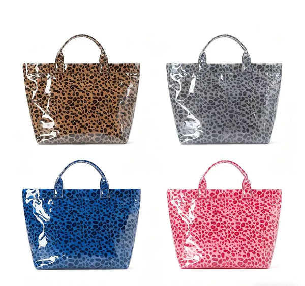 Four tote bags in leopard print and solid colors: brown, gray, blue, and pink.