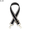 Black and white striped adjustable crossbody strap with gold-toned hardware