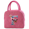 A pink insulated canvas lunch bag featuring a floral butterfly design.