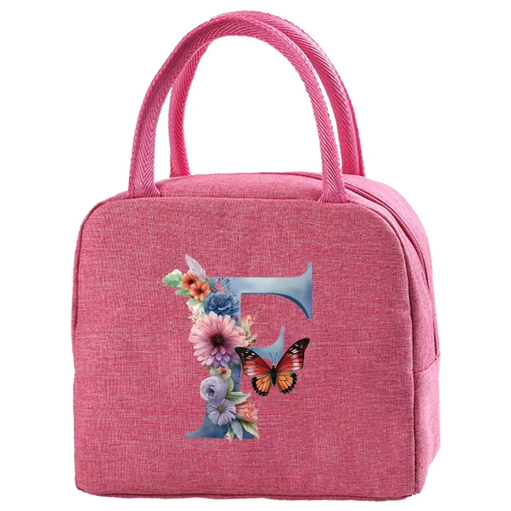 A pink insulated canvas lunch bag featuring a floral butterfly design.