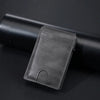 A dark gray PU leather card holder wallet resting on a black cylindrical object.