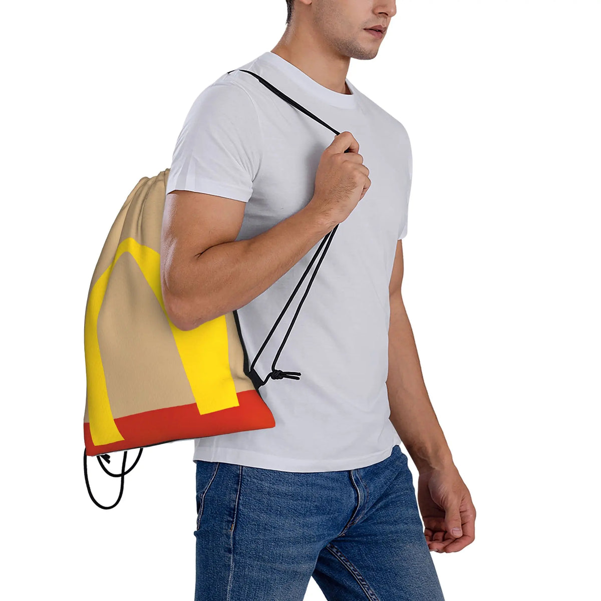 A man is holding a beige and yellow kraft paper drawstring bag with black cord.