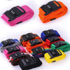 Assortment of black, pink, orange, blue, and green adjustable luggage cross straps with combination locks