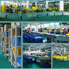 Factory interior showing flexible speaker stand covers and related equipment in a manufacturing environment.