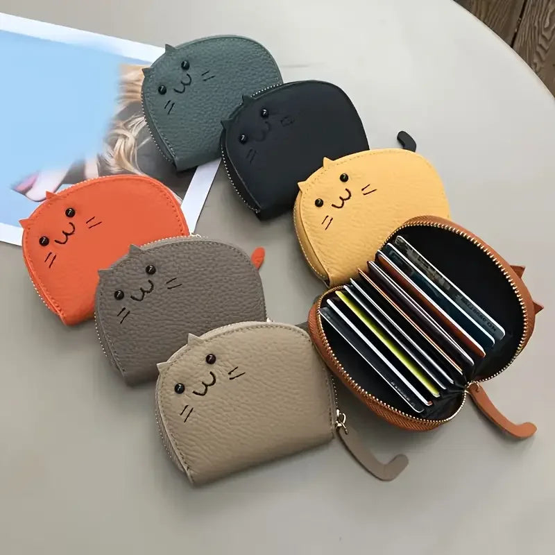 A collection of multi-card wallets featuring a cartoon cat design in various colors including gray, black, orange, and yellow