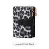 Black leopard print women's wallet with gold-toned zipper and black leather strap