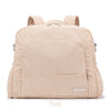 A light pink soft corduroy diaper backpack with padded straps and pockets.