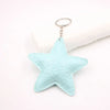 Light blue star shaped leather key chain bag pendant with a silver keyring.