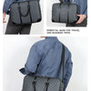 A dark gray executive PU leather laptop briefcase with a black shoulder strap being carried by a person.