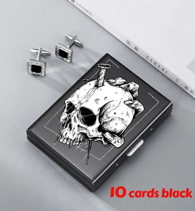 A black slim card holder featuring a detailed skull design and silver-toned card clips.