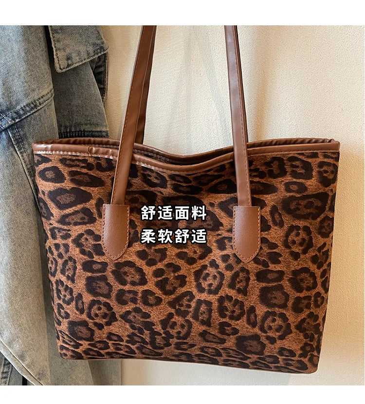 A brown leopard print vintage tote bag with leather handles is shown against a light background.