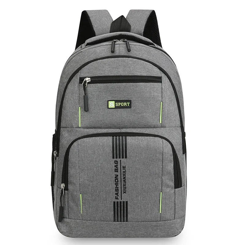 A gray men's lightweight commuter backpack with multiple compartments and a green accent.