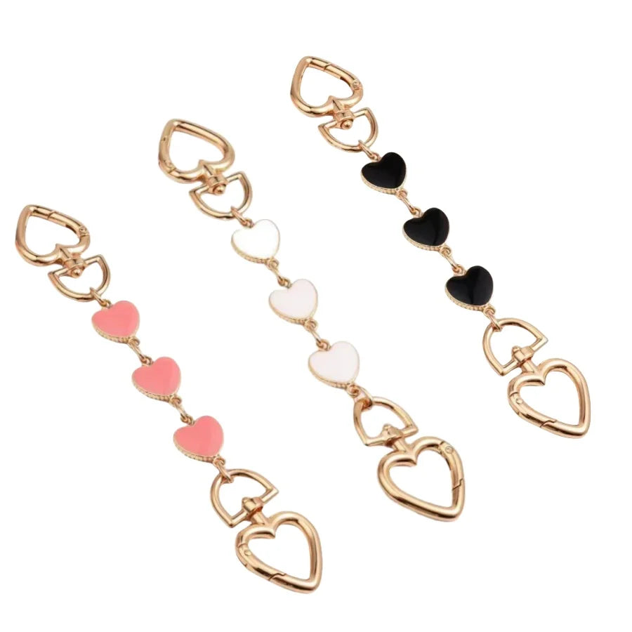 Gold alloy moon-shaped bag chain strap with black and white heart charms
