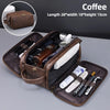 A brown PU leather travel toiletry bag with organizer pockets shown open, displaying various grooming and cosmetic items.