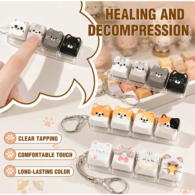 Clear tapping fidget toy and bag charm featuring various cute cat-themed keycaps in pastel colors