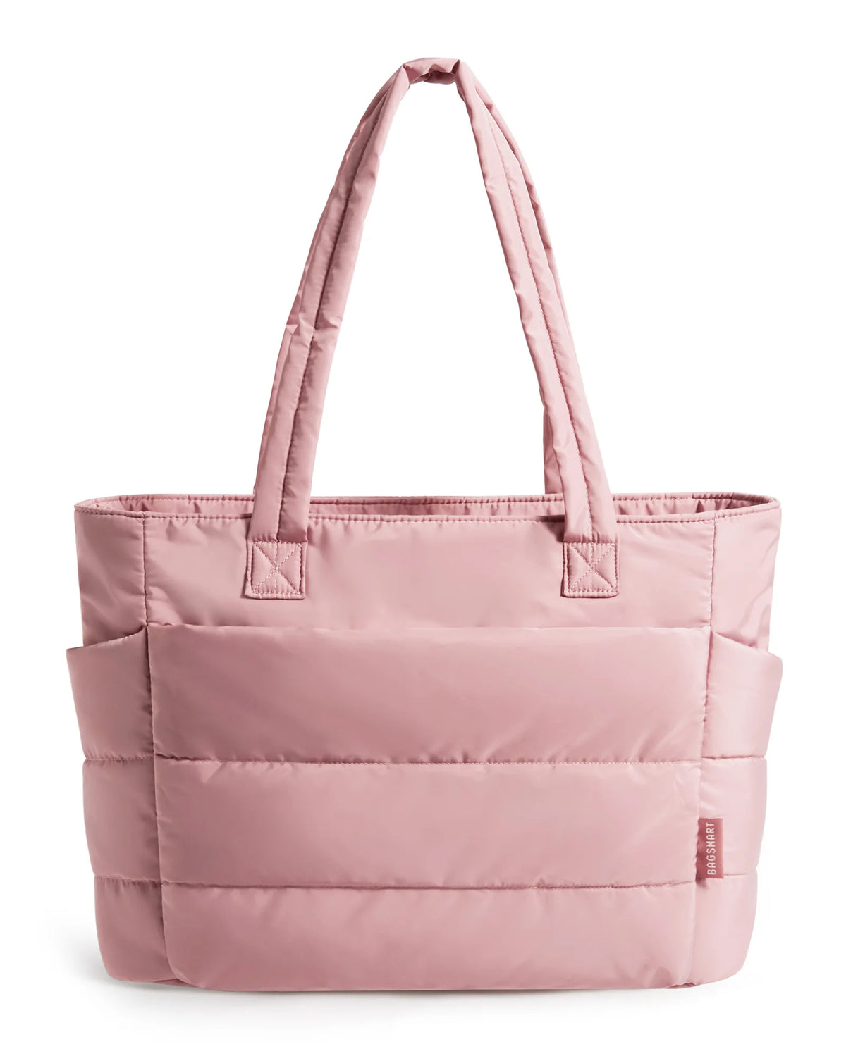 A soft pink quilted tote bag with a fabric handle is shown against a white background.