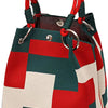 A red and white geometric colorblock knitted bucket bag with a red braided handle.