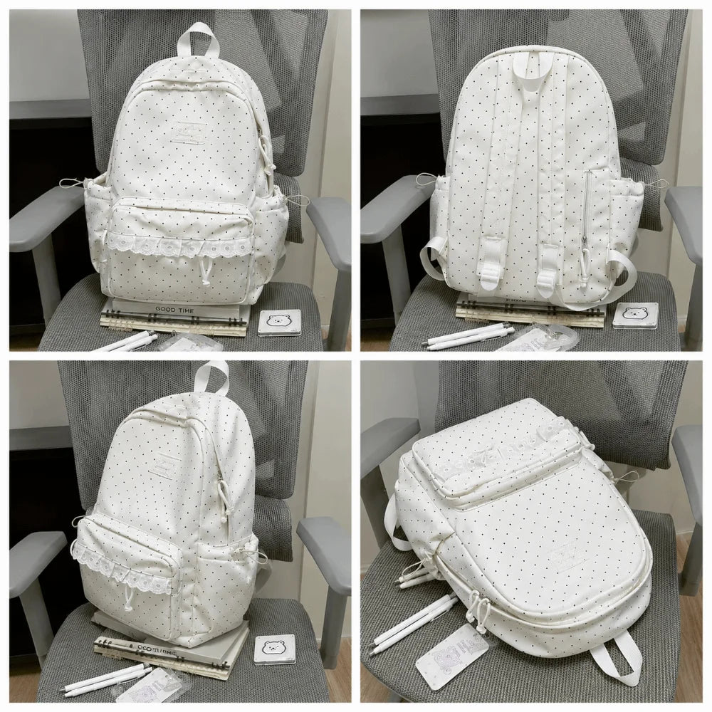 A white polka dot nylon travel backpack is shown from multiple angles on a gray chair.