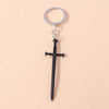 Silver keychain featuring a black sword pendant with a cross and a sun eye design