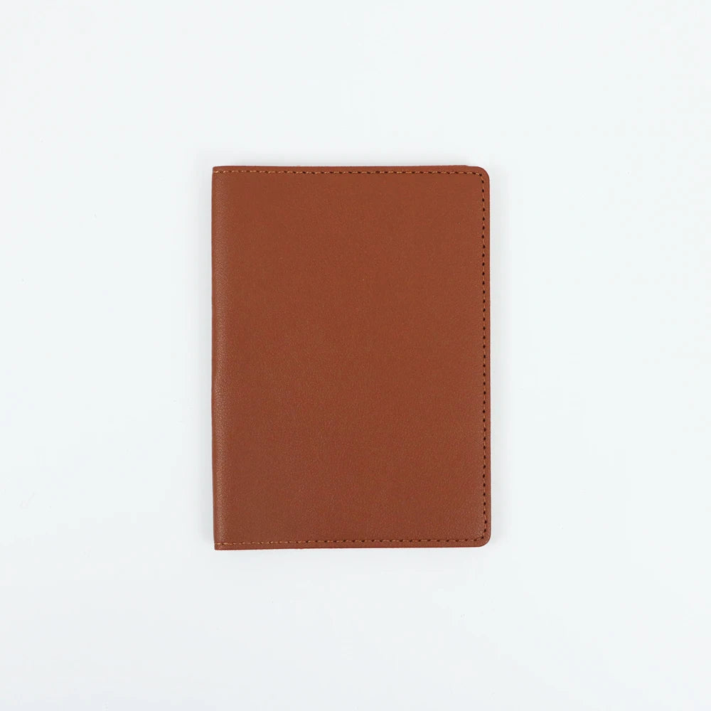A brown PU leather passport holder with stitched edges shown against a white background.