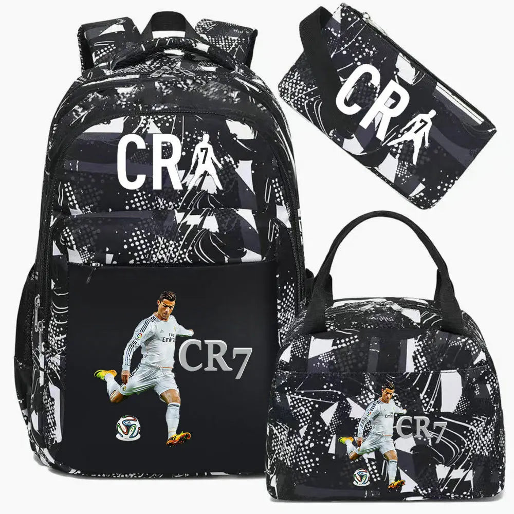 Black and white sports laptop backpack featuring a graphic of a soccer player and an attached rain cover.