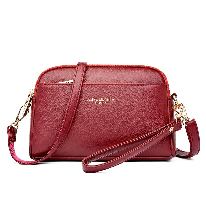 A maroon PU leather trendy shoulder crossbody bag with gold hardware.