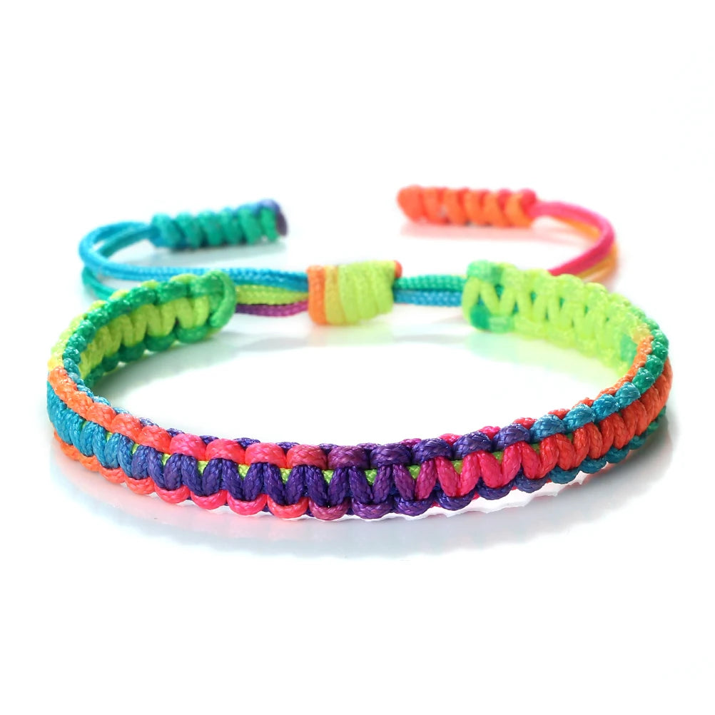 Handmade braided rope bracelet featuring colorful strands of green, yellow, orange, and purple.