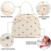 A beige corduroy lunch bag with strong handles, a double zipper, and an extra front pocket.