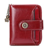 A deep red leather wallet with a brass clasp and card slots shown from the front.