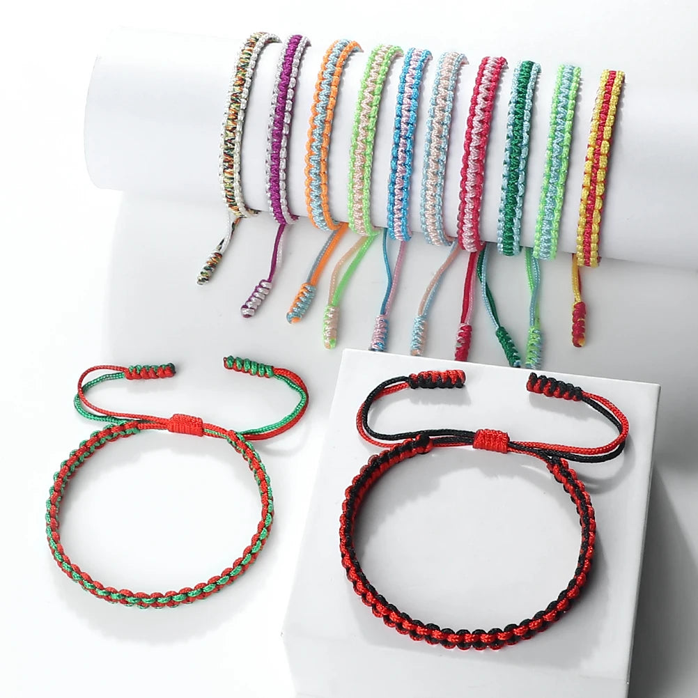 A display of various handmade braided rope bracelets in colorful shades and colors.