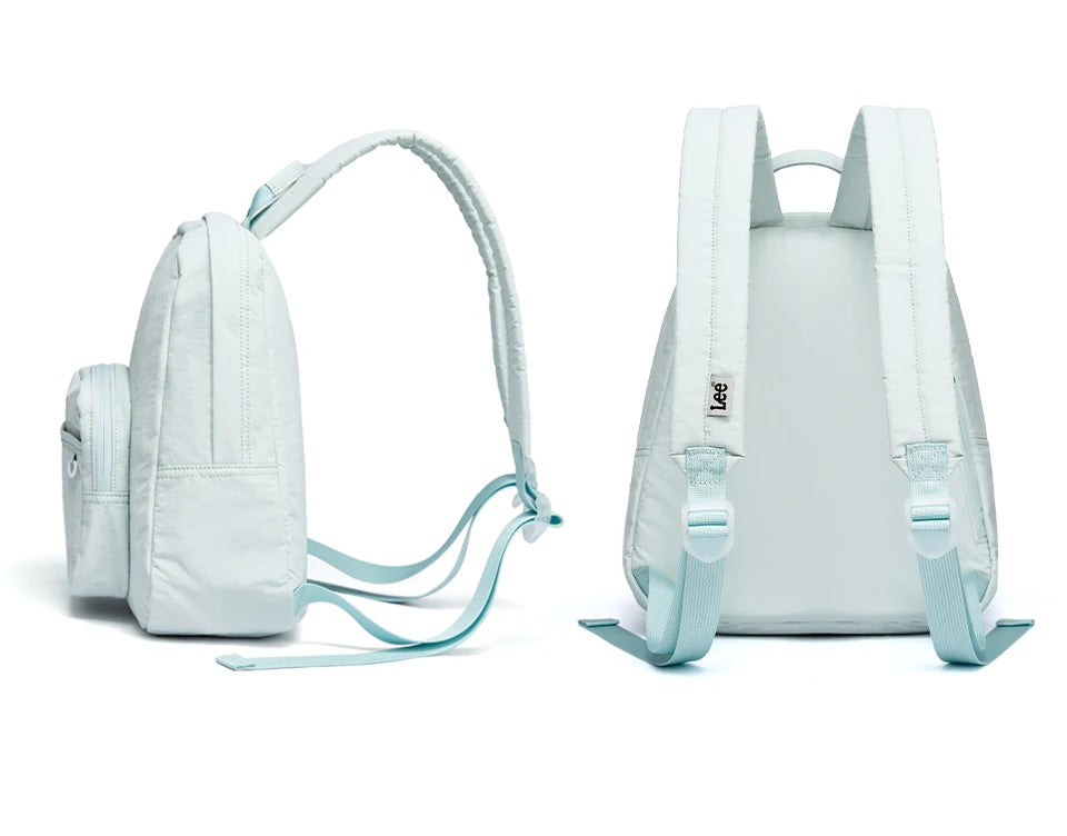 A light blue waterproof daypack is shown from the front and back, highlighting its design and straps.