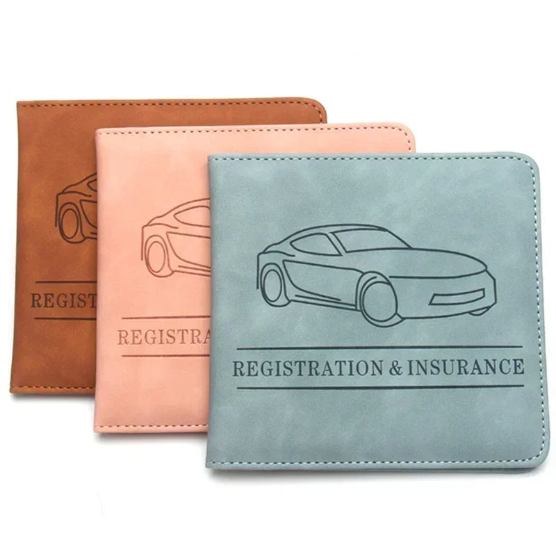 Three leather wallets in brown, pink, and blue shades featuring a car silhouette design for registration and insurance docume