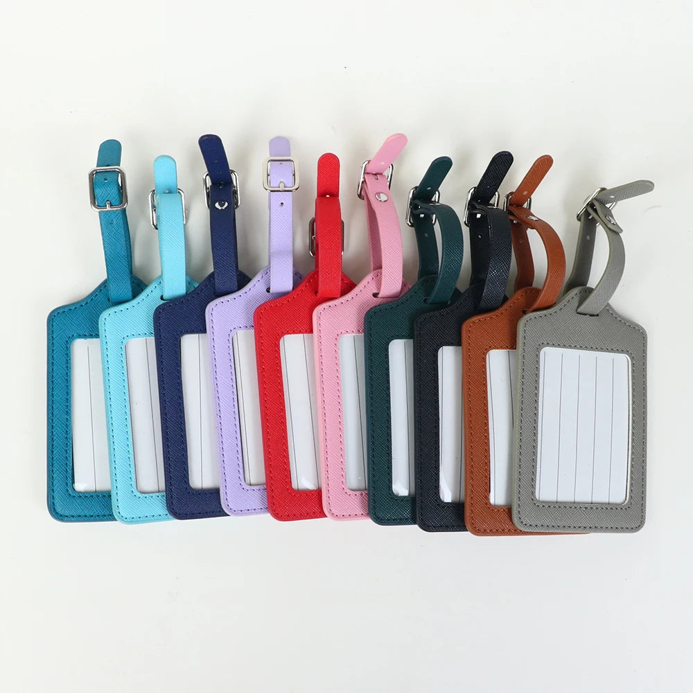 A set of twelve custom PU leather luggage tags in various colors and shades with a cross-pattern detail.