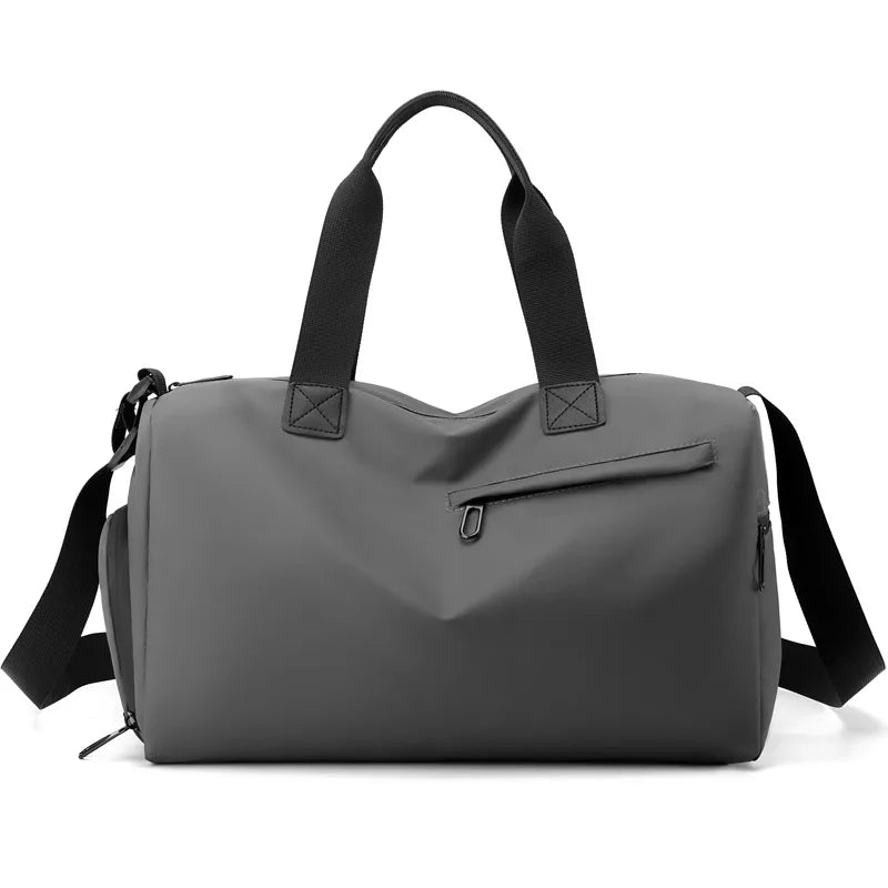 A gray waterproof travel duffle bag with black straps and a separate shoe compartment.