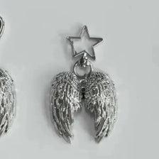 Silver metal angel wing charm with a star pendant on a keyring.