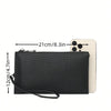 Black clutch bag with a strap shown next to an iPhone for scale.