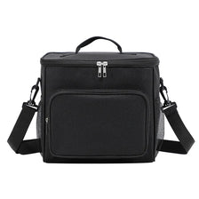 Black insulated reusable lunch bag with an adjustable strap and zipper closure.
