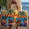A quilted travel duffel bag featuring a tropical sunset and palm tree design.