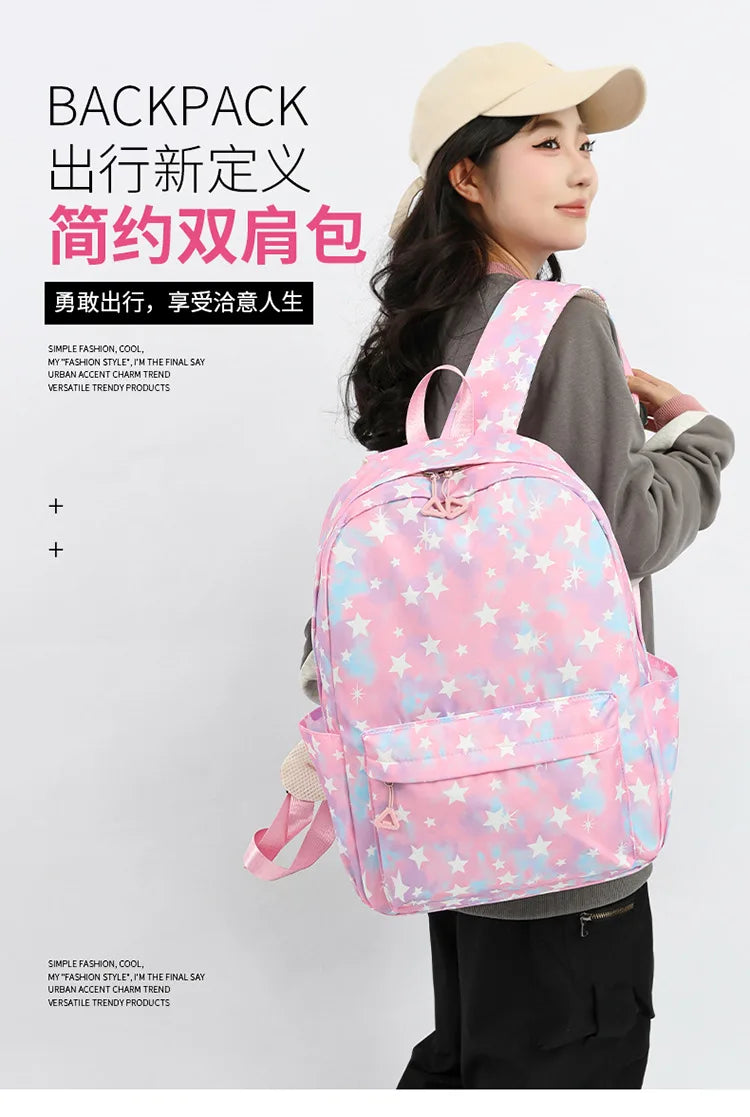 A woman is shown wearing a pink star-patterned nylon backpack, styled with casual clothing.