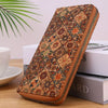 A brown leather wallet with a patterned cover featuring wood-grain textures and multiple card slots.