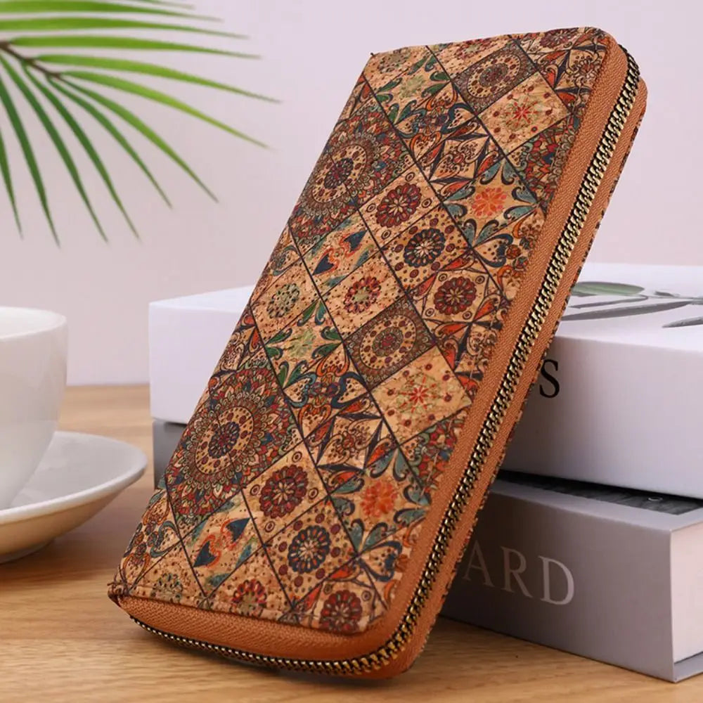 A brown leather wallet with a patterned cover featuring wood-grain textures and multiple card slots.