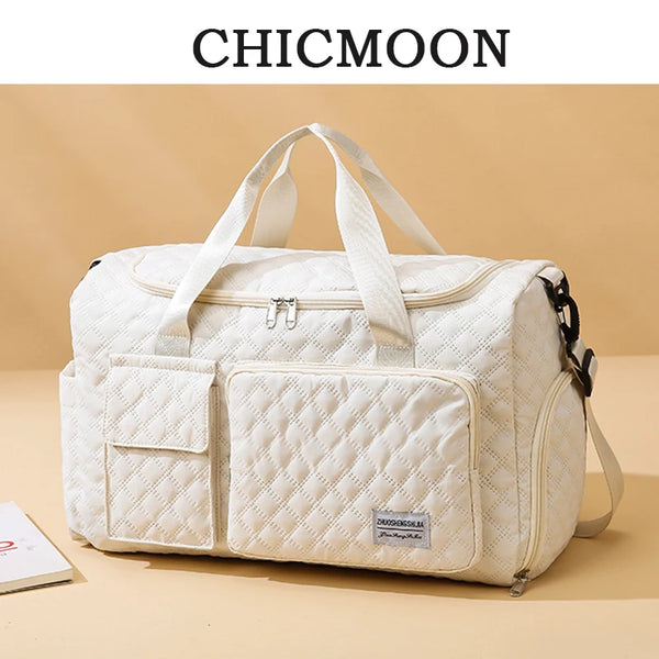 A cream quilted tote shoulder bag with white straps is shown against a neutral background.