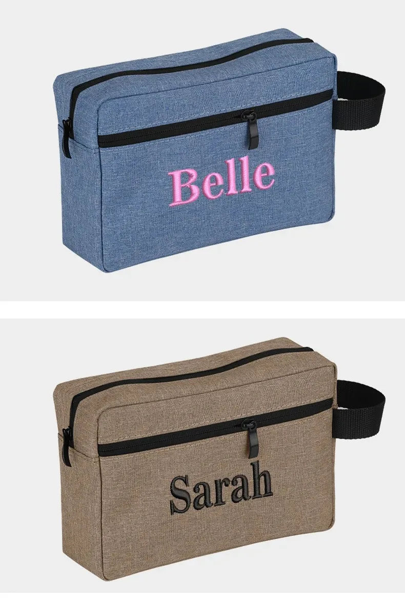 A light blue fabric cosmetic bag embroidered with the name Belle
