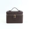 A dark brown PU leather makeup bag with a zipper closure and a carrying loop.