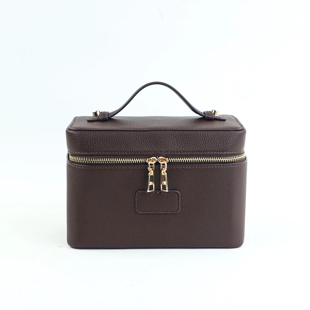 A dark brown PU leather makeup bag with a zipper closure and a carrying loop.