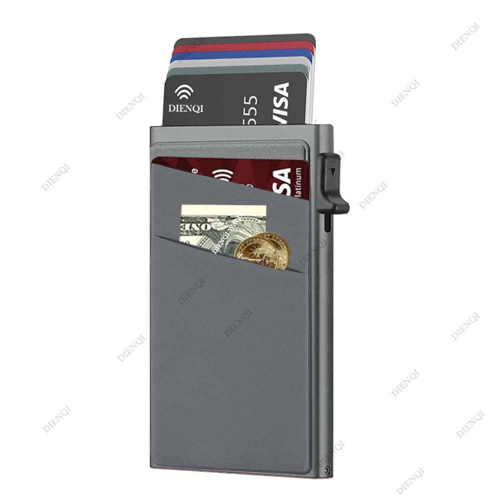 A silver metal card holder displaying various credit cards and cash inside.
