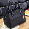 A black vintage PU leather tassel handbag is shown resting on a wooden surface.